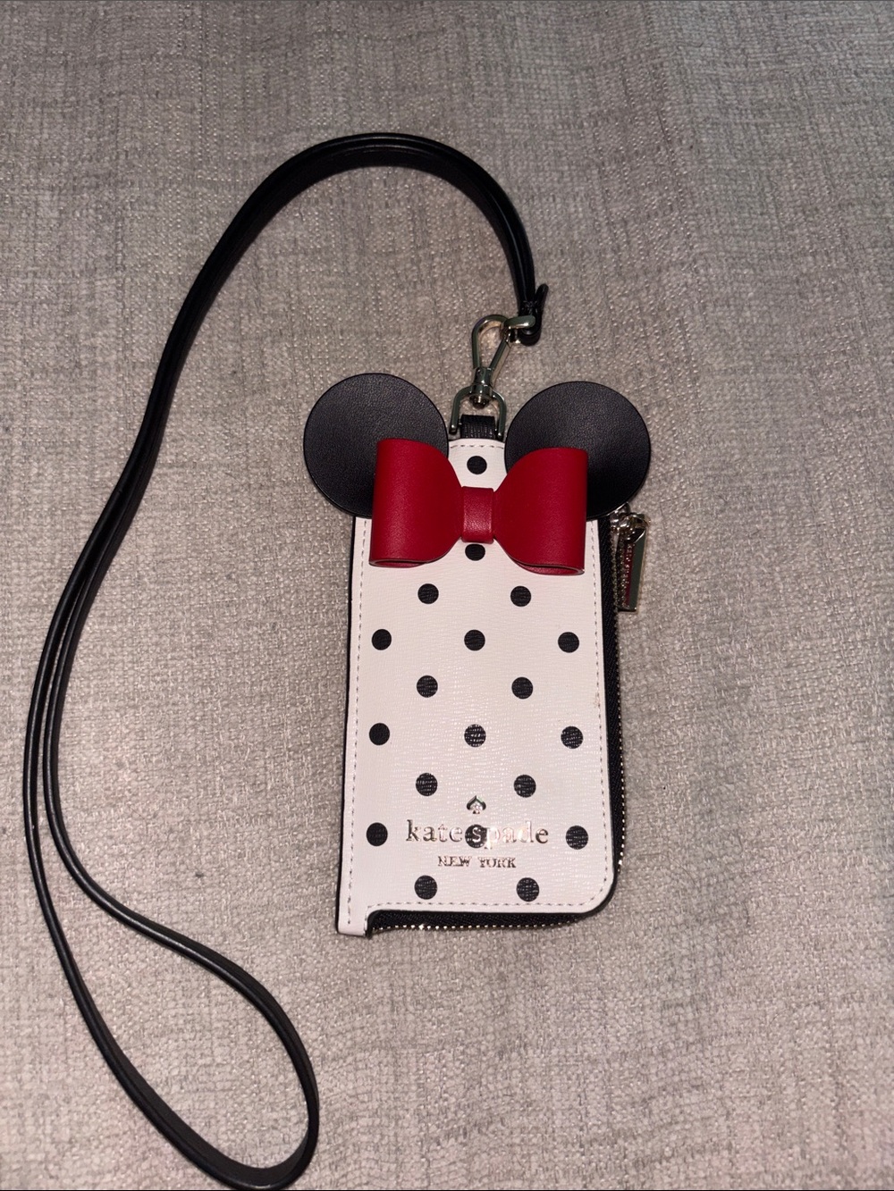 kate spade white and black polka dot wristlet with red bow